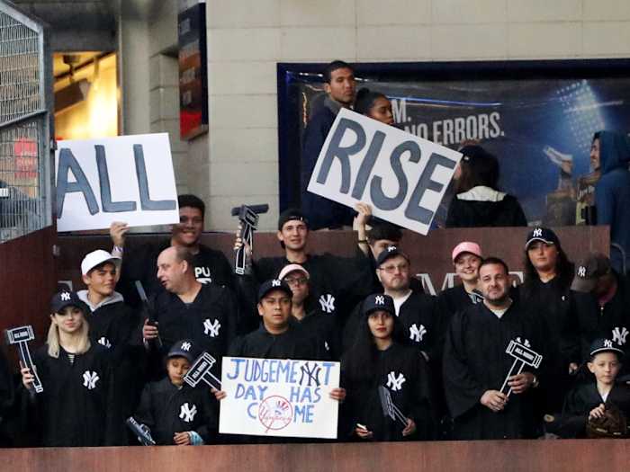May 22, 2017; Bronx, NY, USA;  Fans seated in the right field fan section named “The Judges Chambers” for New York Yankees right fielder Aaron Judge (99) (not pictured) wear judges robes during the game against the Kansas City Royals at Yankee Stadium.